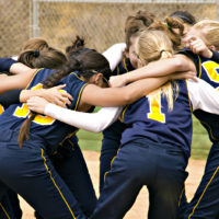 Group of girls huddle before game