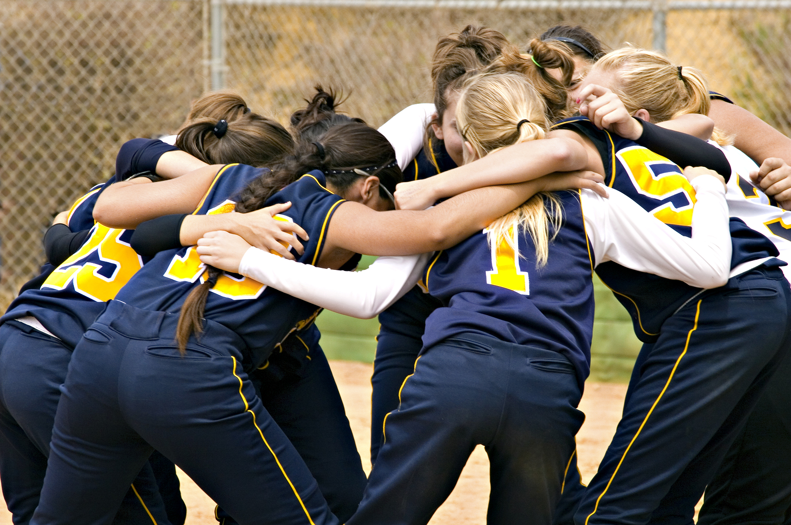 Group of girls huddle before game