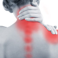 Close up of woman holding neck in pain