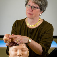 Dr. Elizabeth Sandel showing brain parts