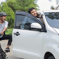 cylist avoiding car door